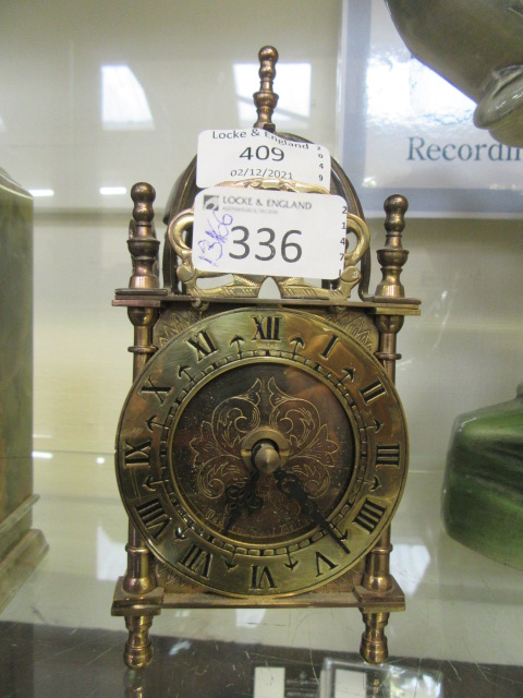 A brass lantern clock converted to battery power