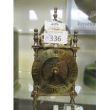 A brass lantern clock converted to battery power