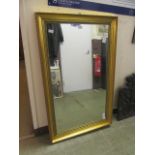 A gilt framed rectangular mirror