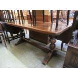 An oak topped dining table with tressle support CONDITION REPORT: Dimensions as