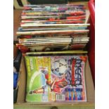 A box containing assorted magazines,