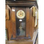 A reproduction walnut cased drop dial wall clock