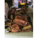 Two trays of assorted brass and copper ware to include a fireside companion set, water jugs,
