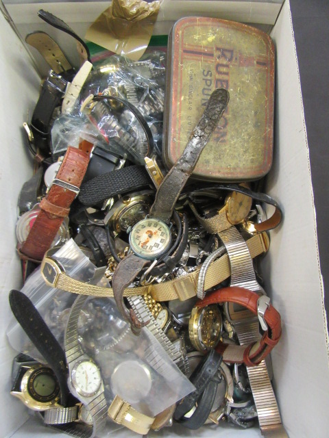 A box containing a large quantity of used wrist watches,
