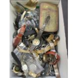 A box containing a large quantity of used wrist watches,