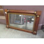 An early 19th century rosewood over mantle mirror