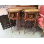 A pair of reproduction French style occasional tables with faux marquetry tops over three drawers