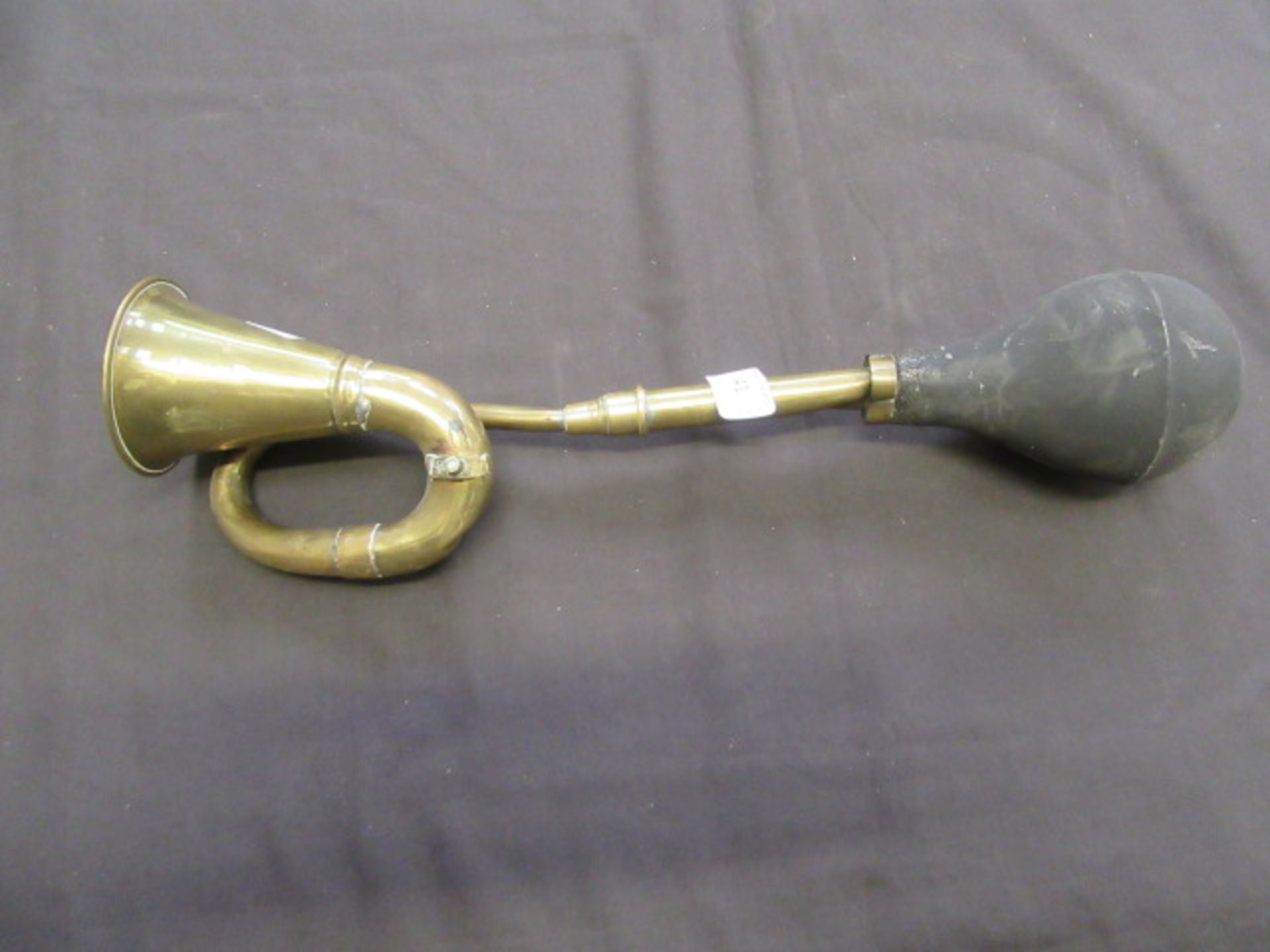 A brass car horn