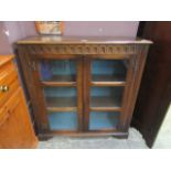 An early 20th century oak two glazed door bookcase