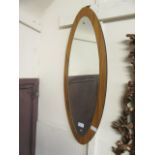 A mid-20th century oval mirror