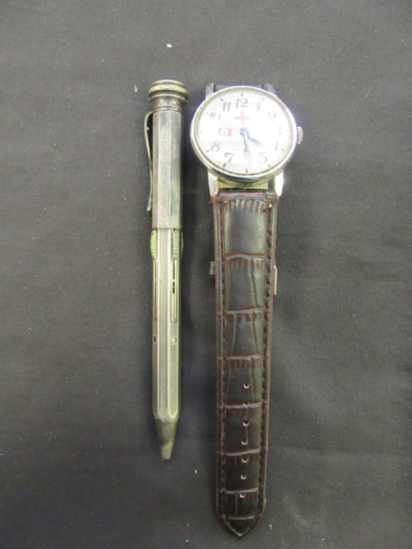 A bag containing a white metal propelling pencil and a gent's watch