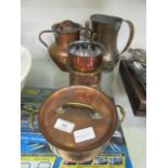 A selection of brass and copper pans
