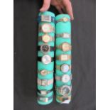 Two rolls of foam containing seventeen gent's wrist watches