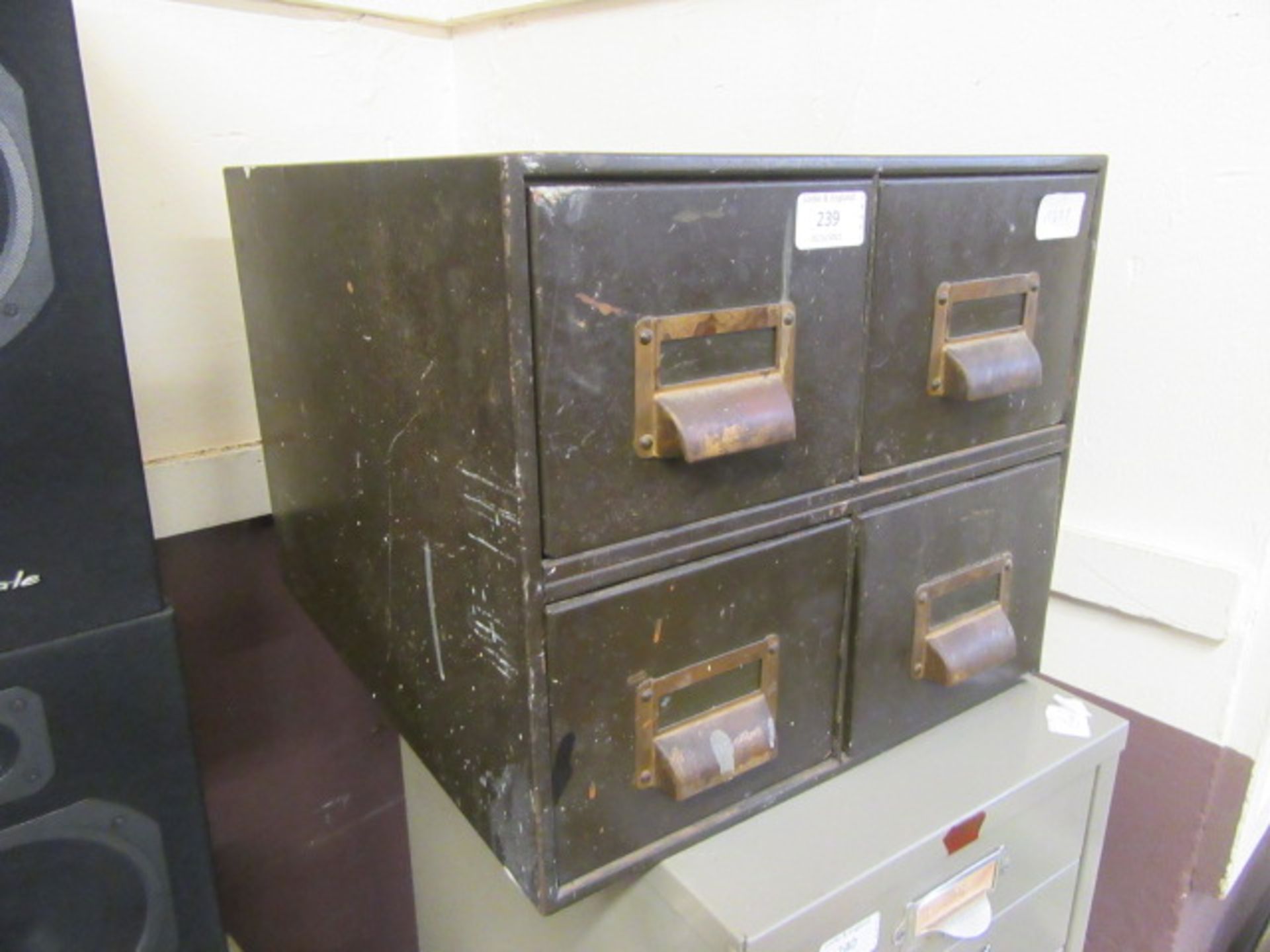 An early 20th century four drawer metal index cabinet