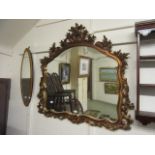 A reproduction Baroque style mirror