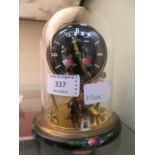 A small mid-20th century anniversary clock with a rose painted design to dial