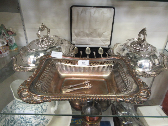 A pair of plated lidded tureens, a box set of six plated grapefruit spoons, plated bowl,