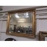 A modern gilt framed bevel glass rectangular mirror