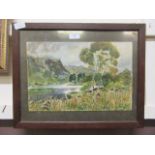 A framed and glazed watercolour of river through mountain scene