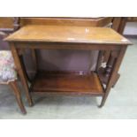 An early 20th century rosewood and inlaid trolley