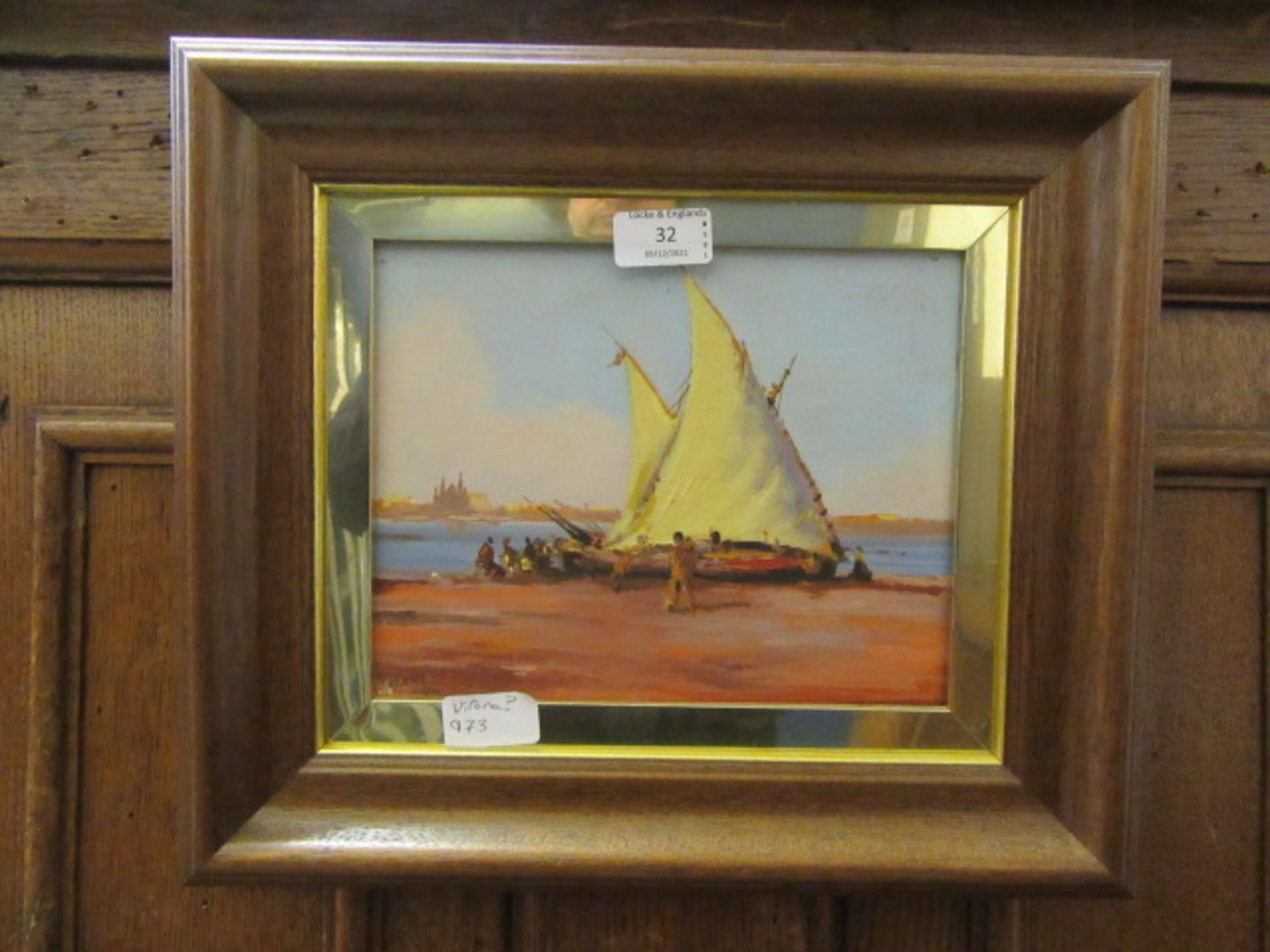 A framed oil on board of sailing vessel signed bottom left,