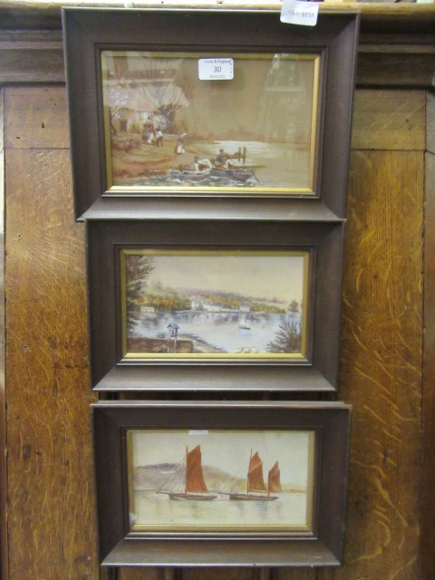 Three framed and glazed oil paintings of sailing vessels,