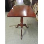 A 19th century pine topped tilt top table