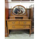 An early 20th century mahogany and satinwood banded dressing chest