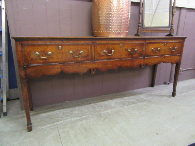 A mid 18th century oak and mahogany banded dresser base,