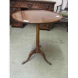 An 18th century and later mahogany and elm tripod table