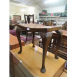 A early 20th century mahogany cane seat stool on cabriole legs