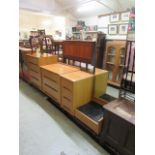A mid 20th century oak veneered chest of four long drawers along with a matching chest of three