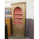 A modern pine barrel back floor standing corner cupboard,