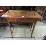 A late Victorian mahogany side table having a tan tooled leather insert top with single drawer on