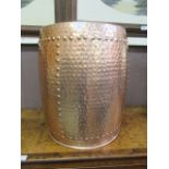 A modern copper effect log bin