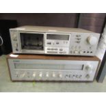 A Sony tape player along with a Yamaha stereo reciever