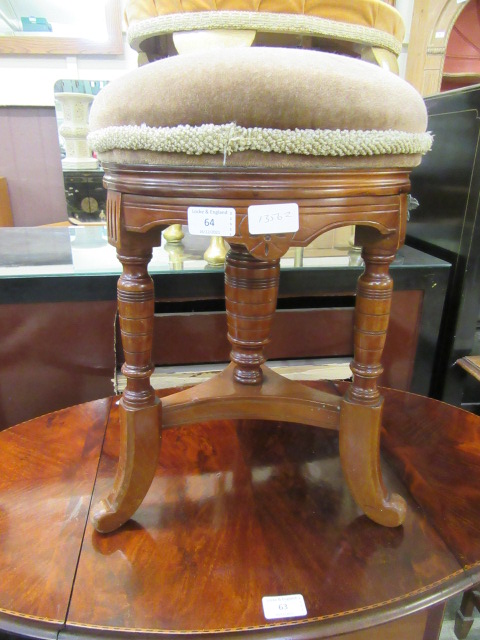 An Edwardian mahogany circular stool