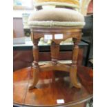 An Edwardian mahogany circular stool