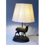 TABLE LAMP, bronzed metal stag with oval base and shade, 70cm H.