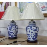 TABLE LAMPS, a pair, Chinese export style blue and white, with shades. (2)