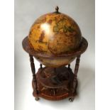GLOBE COCKTAIL CABINET, in the form of an antique terrestrial globe on stand, with rising lid, 91.