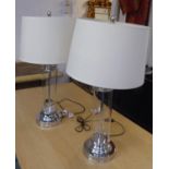 ANDREW MARTIN HAMILTON TABLE LAMPS, a pair, each with a glass column, a cream shade and a circular