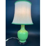 TABLE LAMP, Chinese apple green ceramic fishtail vase with carved hardwood base and linen shade,