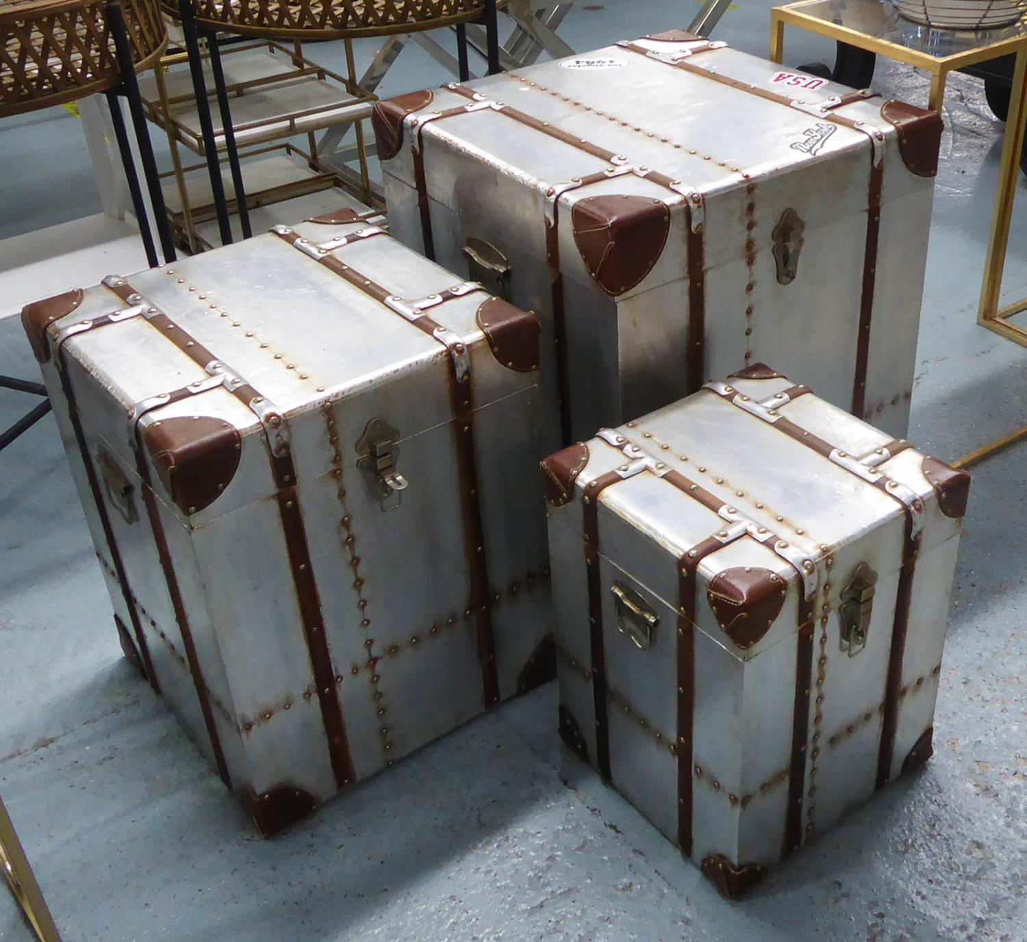 AVIATOR TRUNKS, a set of three vintage style metal with studded detail, largest 51cm W x 51cm D x