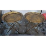 TRAY TABLES, a pair, champagne gilt finished metal, 66cm x 66cm Diam. (2)
