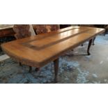 DINING TABLE, Indian teak with profuse carving raised on cabriole supports, with additional leaf,