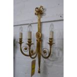WALL SCONCES, a pair, polished brass with ribbon and paterae detail, 68cm H x 35cm. (2)