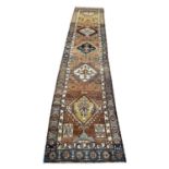 ANTIQUE SERAPI RUNNER, 395cm x 75cm.