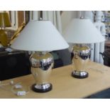 ANDREW MARTIN TABLE LAMPS, a pair, polished metal of baluster form, each with a cream shade, 71cm H.