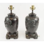LAMPS, a pair, Meiji style with foo dog decoration on carved wooden bases, 40cm H. (2) (with faults)